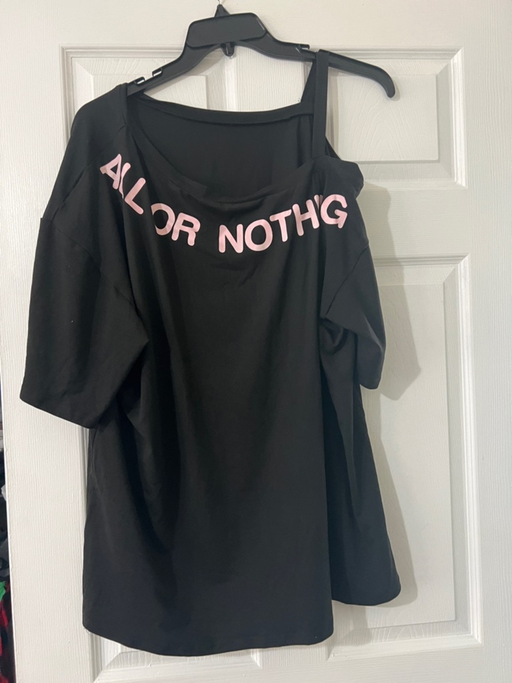 Black Off-Shoulder Tee with Pink Lettering